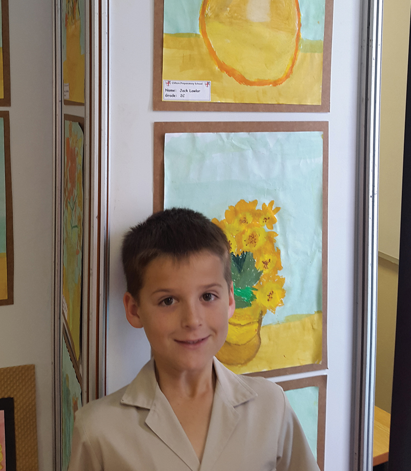 Grade 2: Standing next to his drawing at the Art Meander.