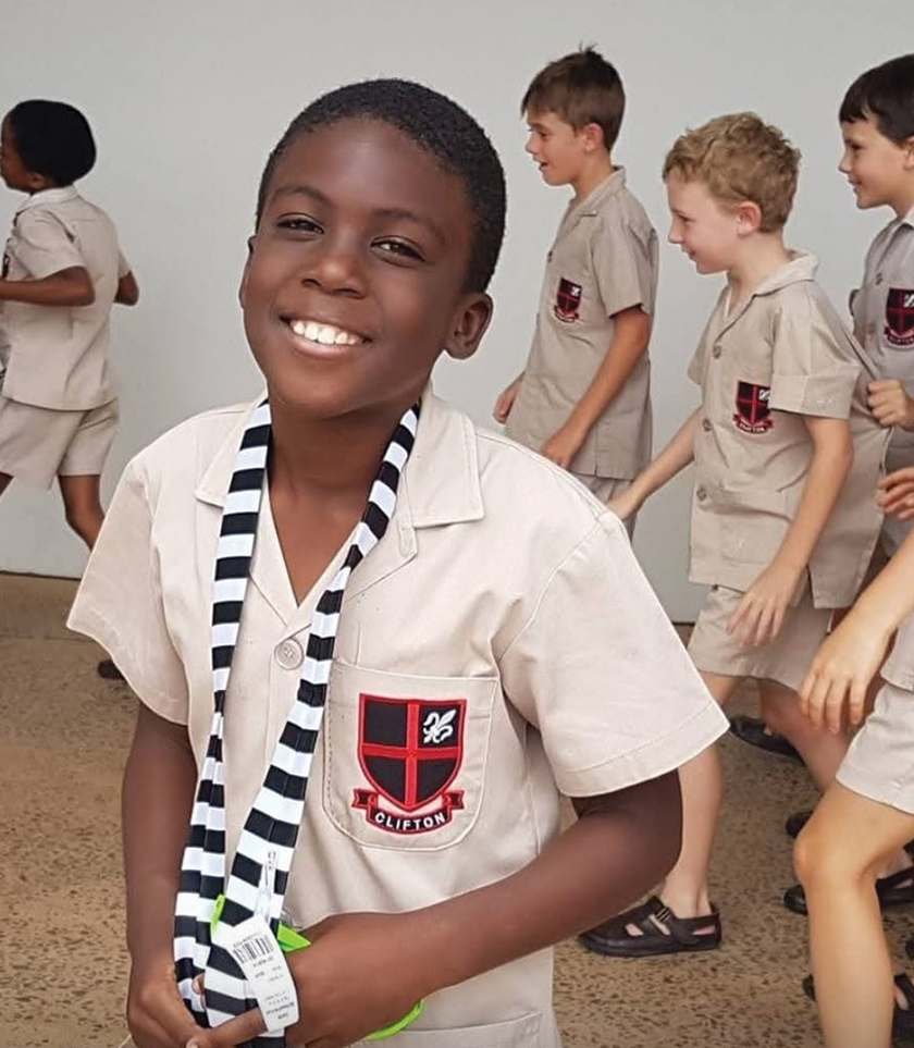 Grade 4: Receiving his Senior Prep tie.